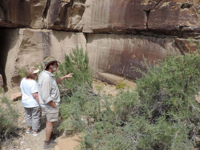 Michael and trustee Kay Sundberg observing the pictographs in Nine Mile Canyon on the 2015 board trip.